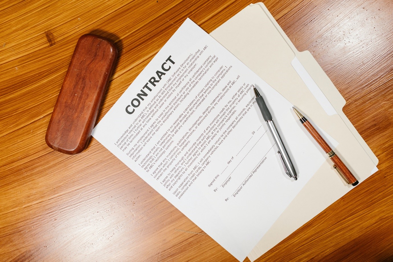 Photo of an employment contract on a wooden table